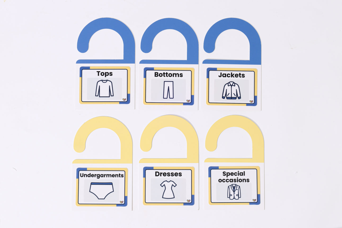 A sheet of The Familiar Space™ reusable TPE home labels with clear icons.
