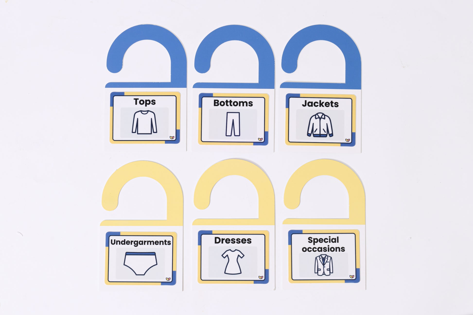 A sheet of The Familiar Space™ reusable TPE home labels with clear icons.