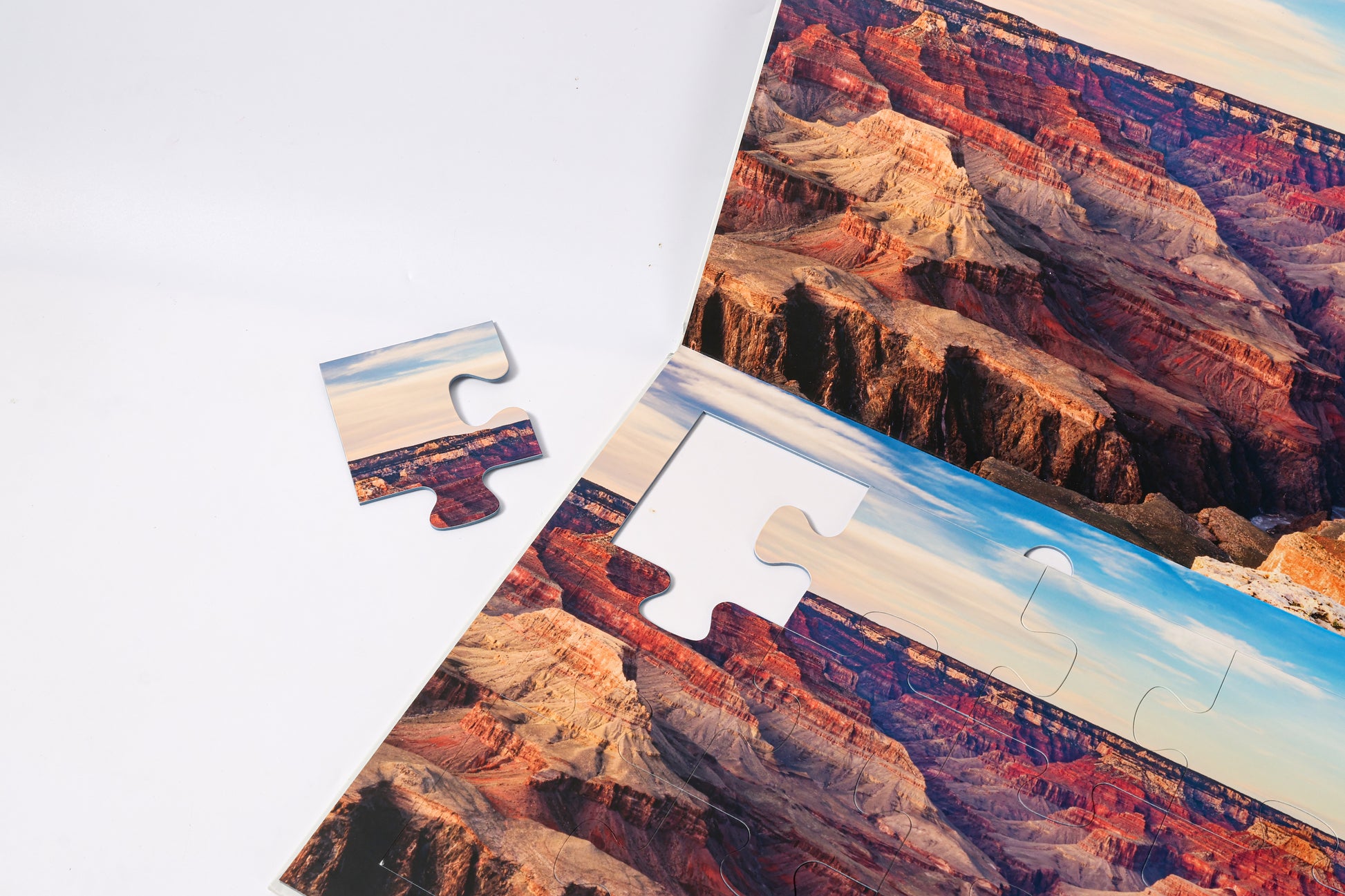 The 2-in-1 Breathtaking Mountains puzzle book, closed.