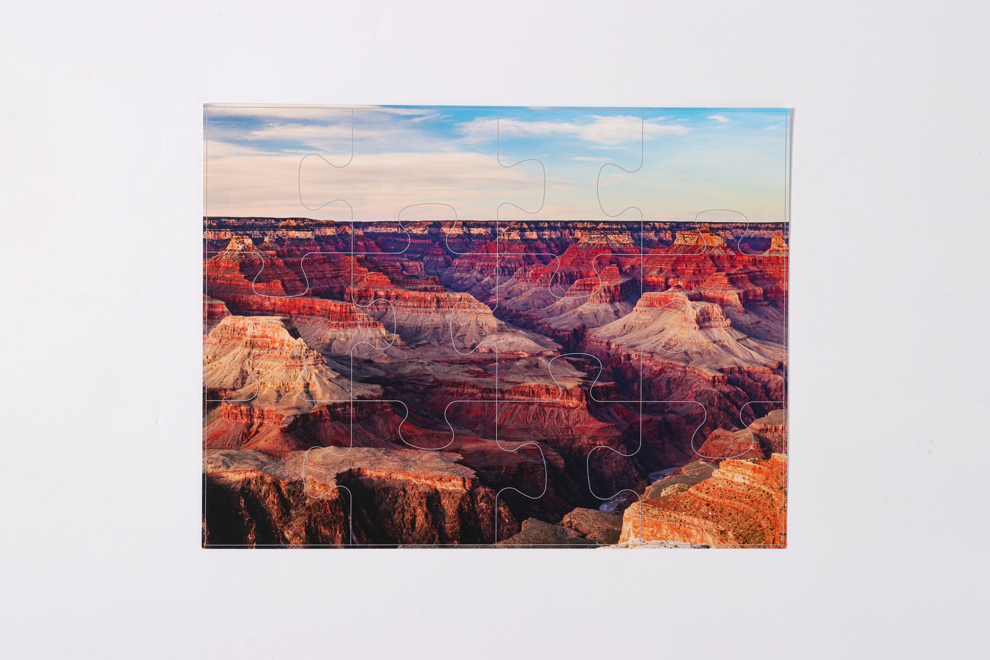 Assembled bamboo stand holding the 2-in-1 Breathtaking Mountains puzzle book.