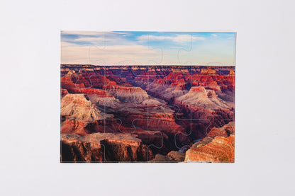 Assembled bamboo stand holding the 2-in-1 Breathtaking Mountains puzzle book.