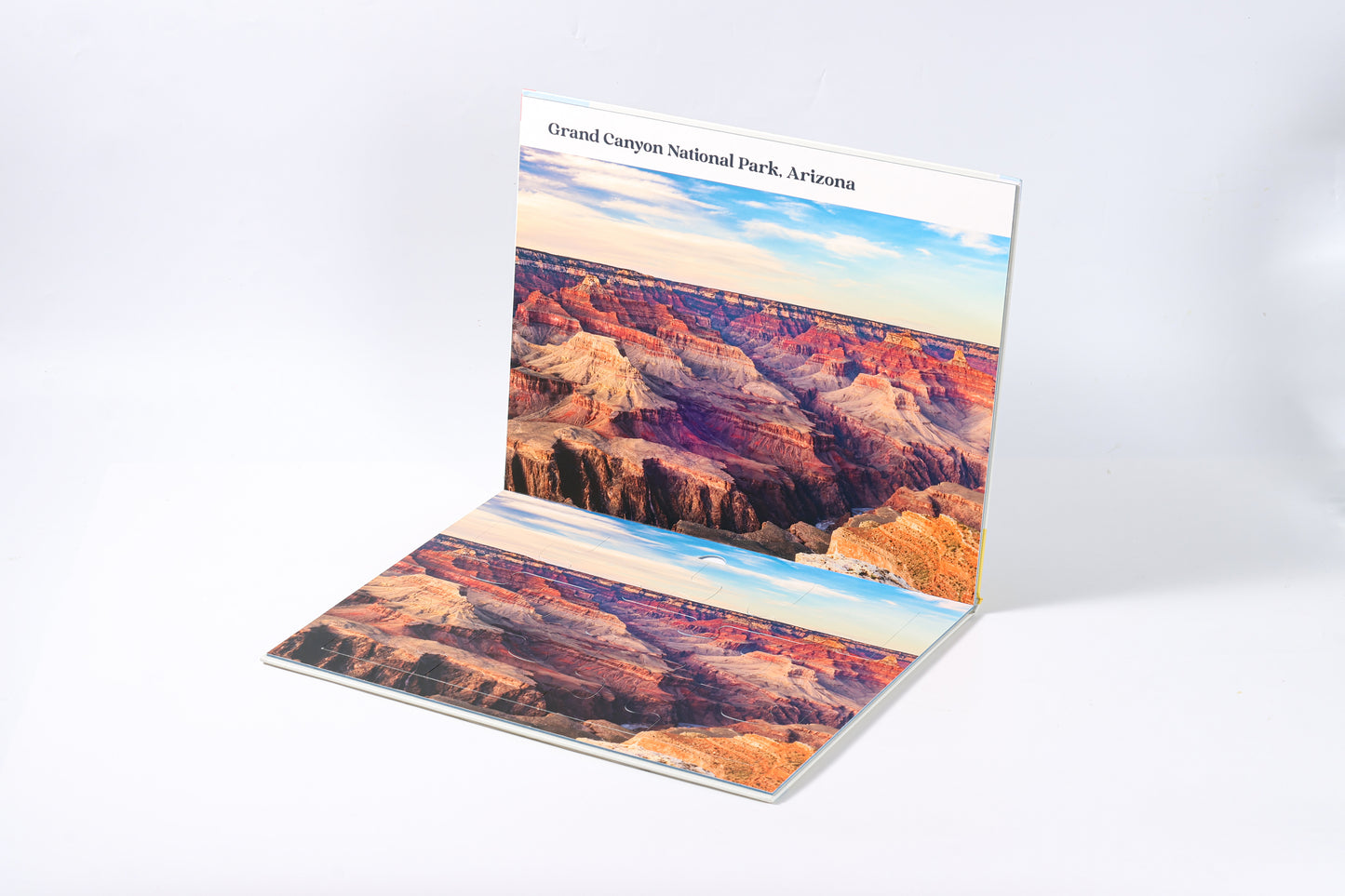 The 2-in-1 Breathtaking Mountains puzzle book, closed.