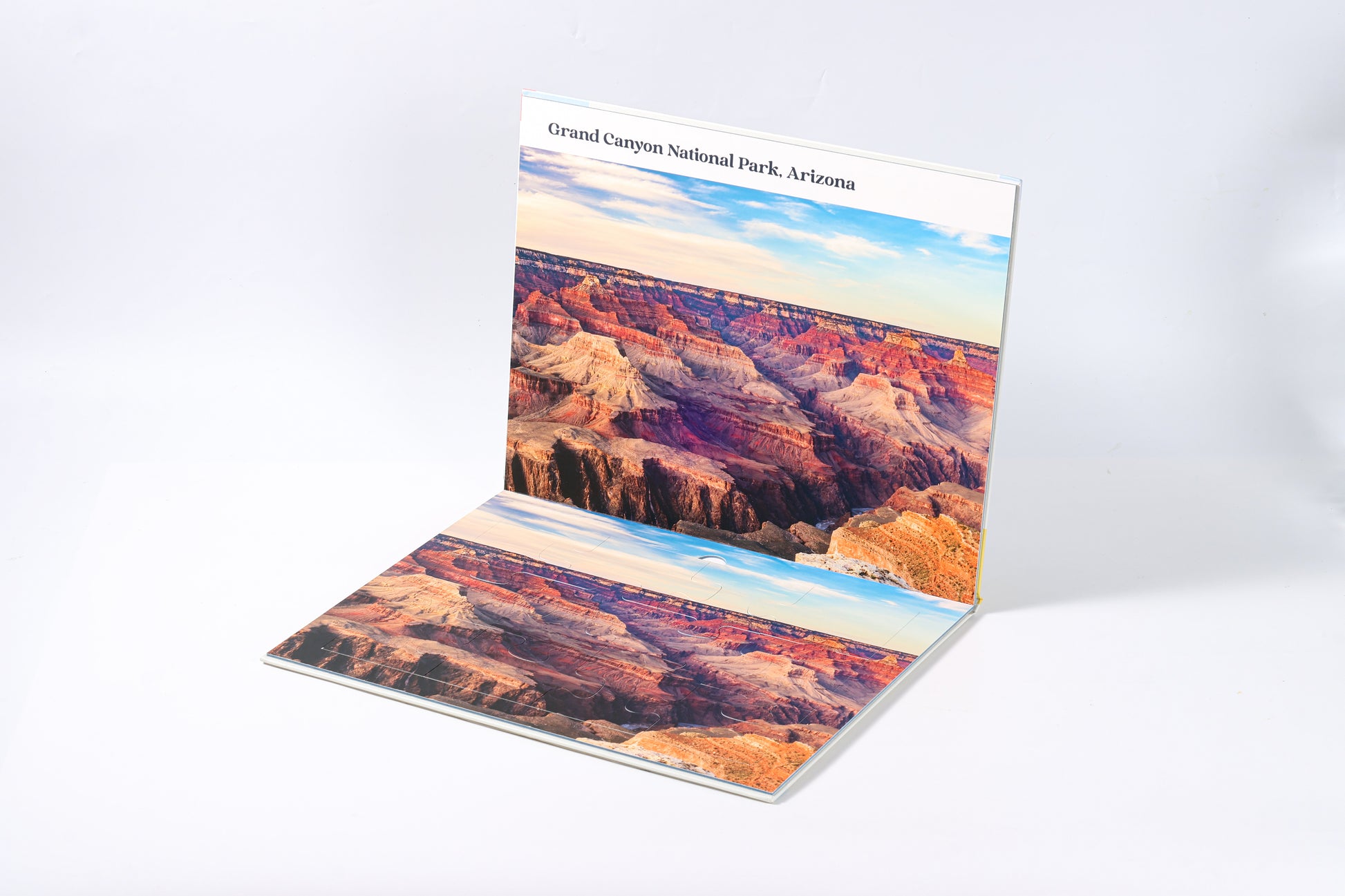 The 2-in-1 Breathtaking Mountains puzzle book, closed.