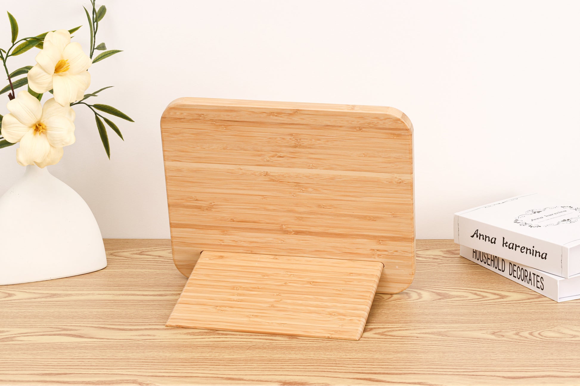 Assembled bamboo stand holding the 2-in-1 Breathtaking Mountains puzzle book.